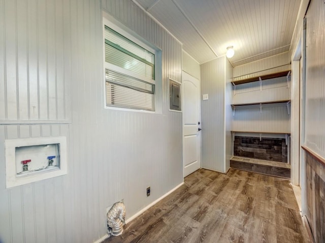 311 W Acheson St, Denison, TX 75020 - laundry room featuring hookup for a washing machine, electric panel, and hardwood / wood-style flooring