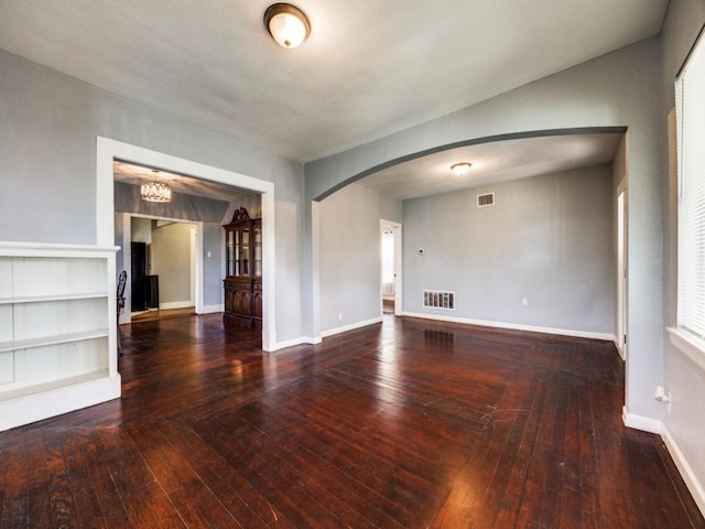 311 W Acheson St, Denison, TX 75020 - unfurnished living room featuring hardwood / wood-style flooring