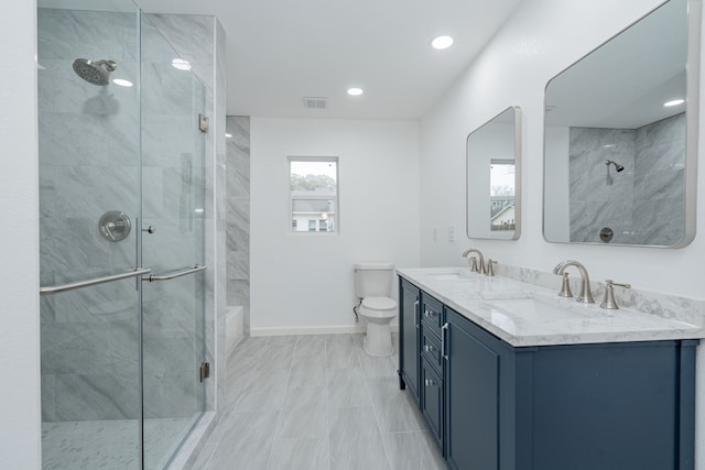 bathroom featuring vanity, toilet, and walk in shower