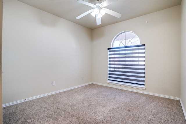 spare room featuring carpet floors and ceiling fan