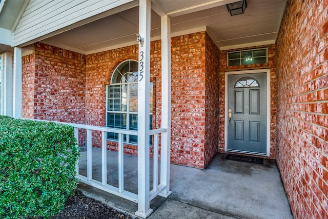 doorway to property featuring a porch