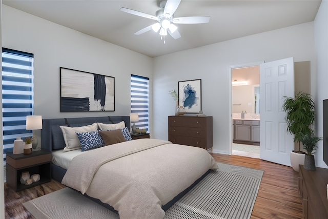 bedroom with hardwood / wood-style floors, ensuite bath, and ceiling fan