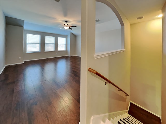 unfurnished room with ceiling fan and dark hardwood / wood-style floors