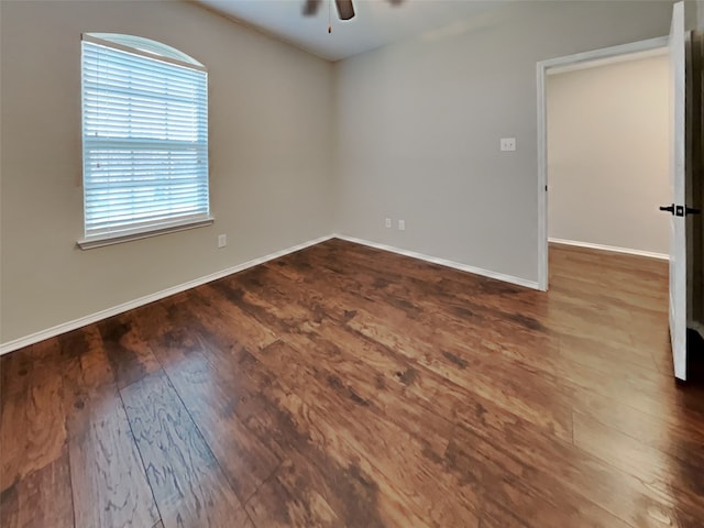 unfurnished room with hardwood / wood-style flooring and ceiling fan