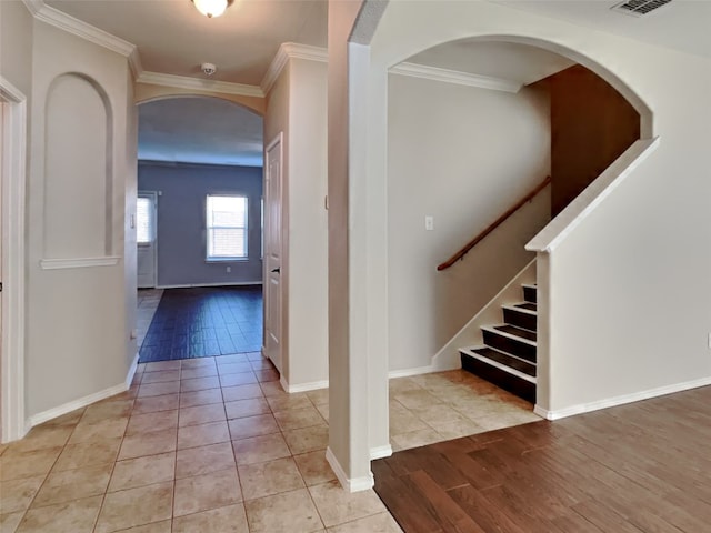 hallway featuring crown molding and light wood-type flooring