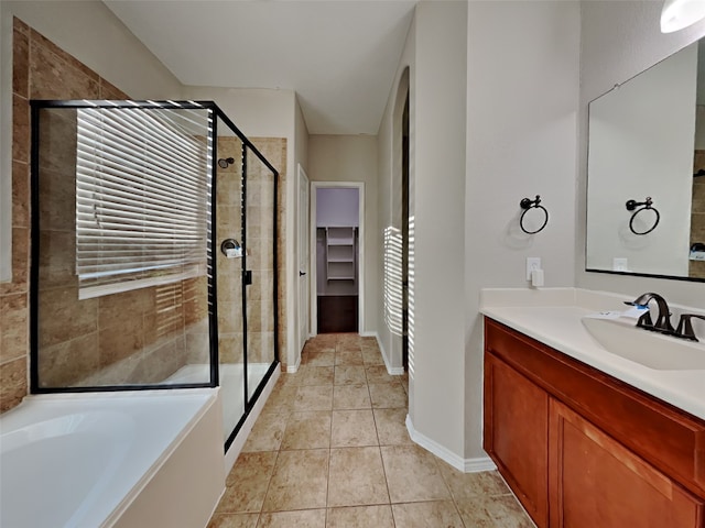 bathroom with vanity, tile patterned floors, and separate shower and tub