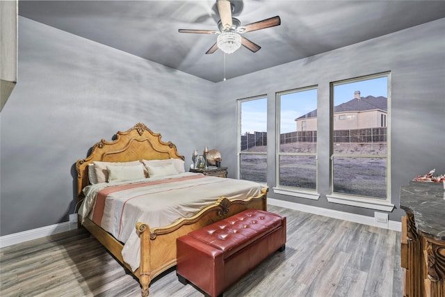 bedroom featuring hardwood / wood-style floors and ceiling fan