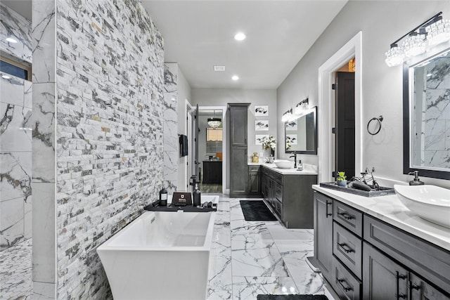 bathroom with vanity and a bathtub