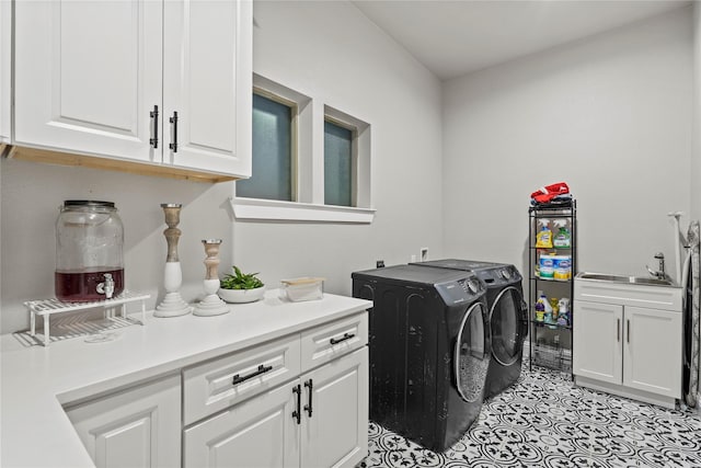 laundry room with cabinets, sink, light tile patterned floors, and independent washer and dryer