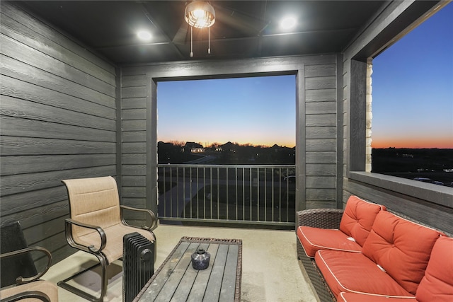 view of balcony at dusk