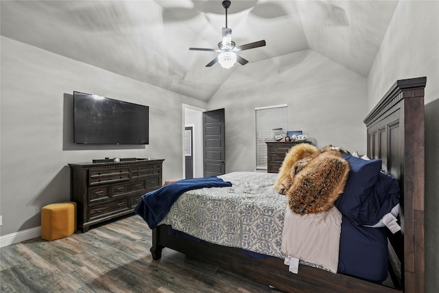 bedroom with hardwood / wood-style floors, vaulted ceiling, and ceiling fan