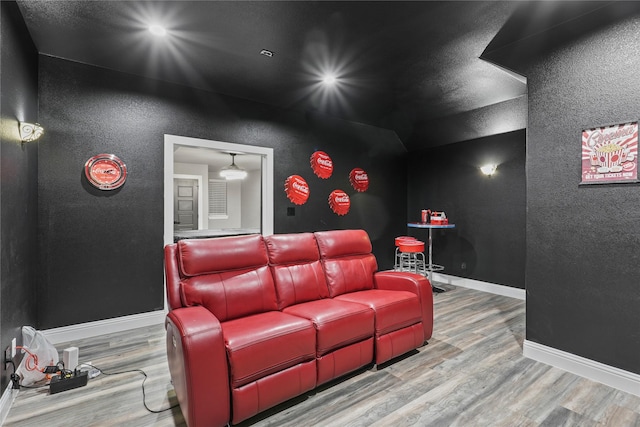 home theater room featuring hardwood / wood-style floors