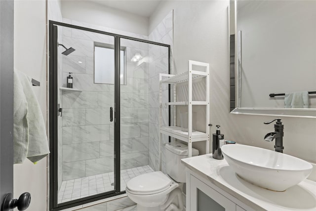 bathroom featuring vanity, toilet, and walk in shower