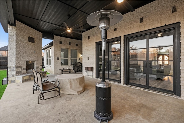 view of patio / terrace with a large fireplace