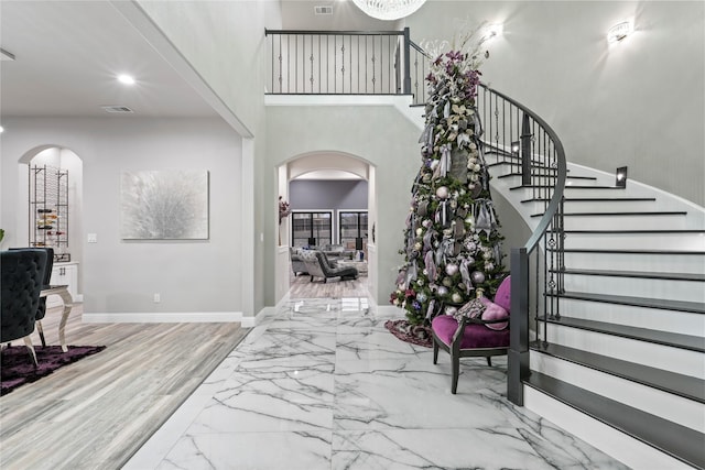 foyer entrance with a high ceiling