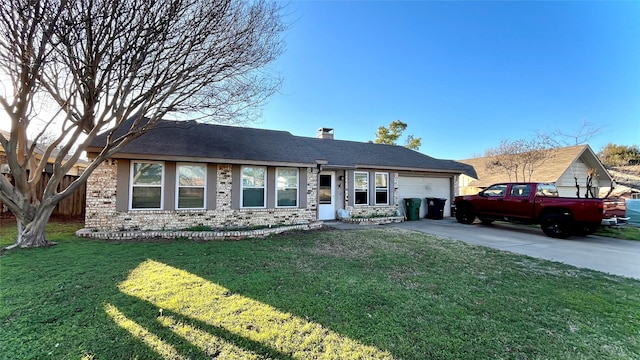 ranch-style house featuring a garage and a front yard