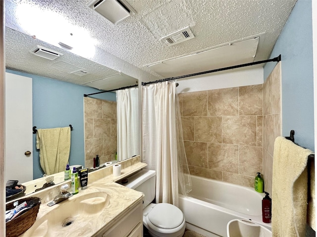 full bathroom featuring shower / bath combination with curtain, vanity, toilet, and a textured ceiling