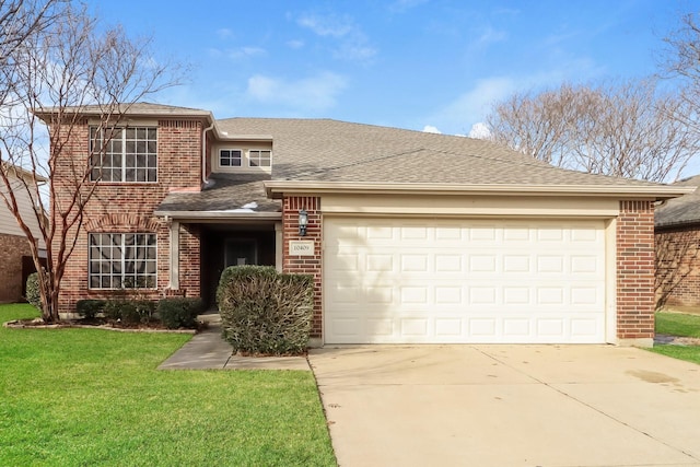 view of front of house with a garage and a front lawn