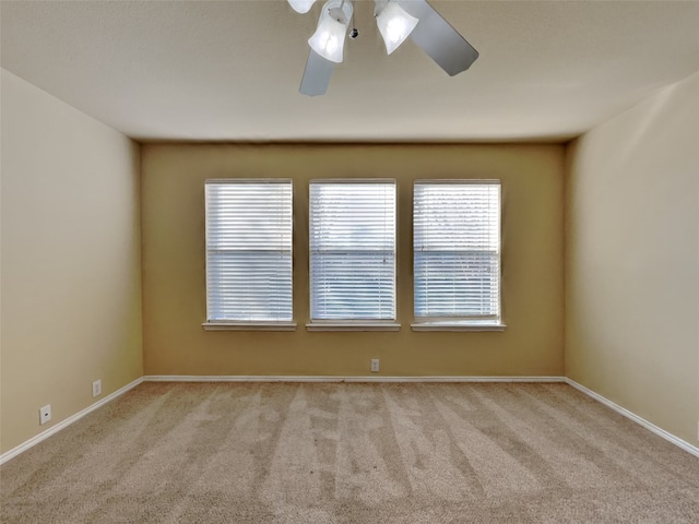 unfurnished room with light carpet and ceiling fan