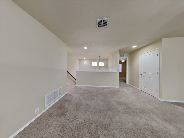 empty room featuring light carpet