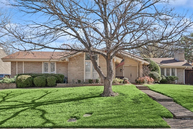 single story home with a front yard