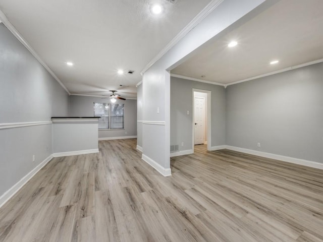 unfurnished living room with ceiling fan, ornamental molding, and light hardwood / wood-style floors