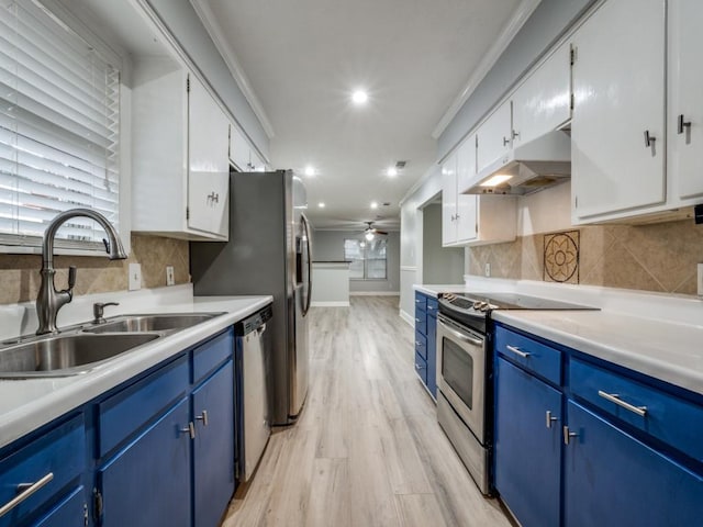 kitchen featuring sink, ceiling fan, stainless steel appliances, white cabinets, and blue cabinets