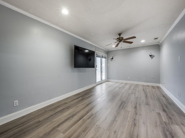 spare room with ceiling fan, ornamental molding, and light hardwood / wood-style floors