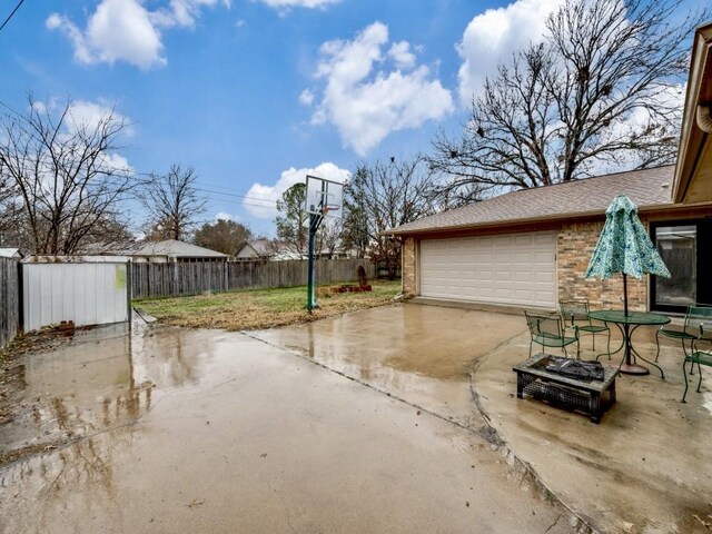 view of patio featuring a garage