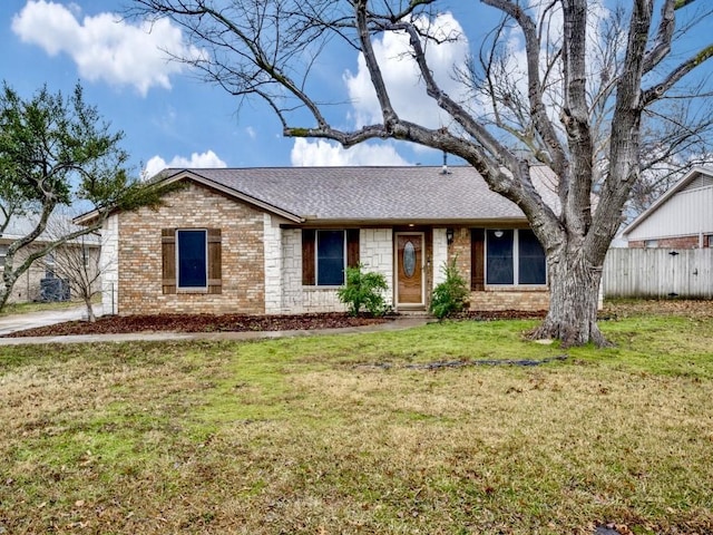 single story home featuring a front yard