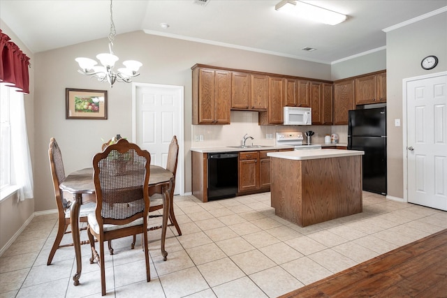 kitchen featuring light tile patterned flooring, a kitchen island, pendant lighting, and black appliances