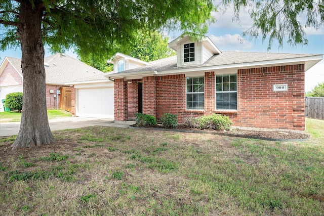 single story home with a garage and a front lawn