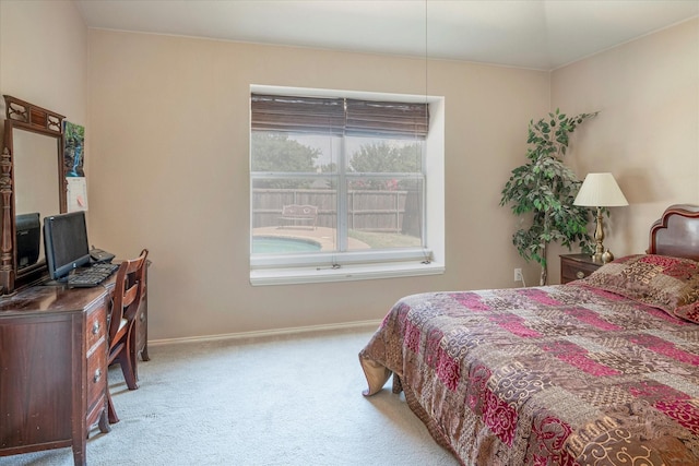 bedroom featuring light colored carpet