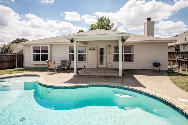 view of swimming pool with a patio