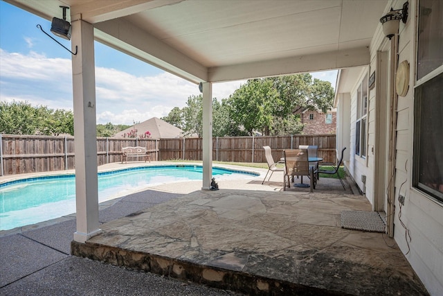 view of swimming pool with a patio