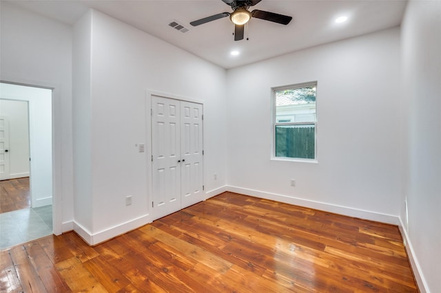 unfurnished room featuring hardwood / wood-style floors and ceiling fan