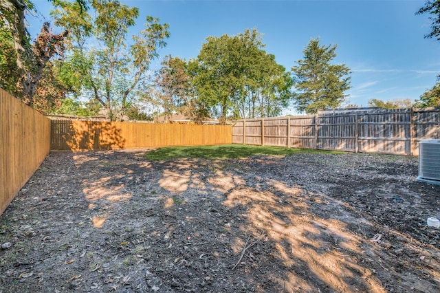 view of yard featuring central AC unit