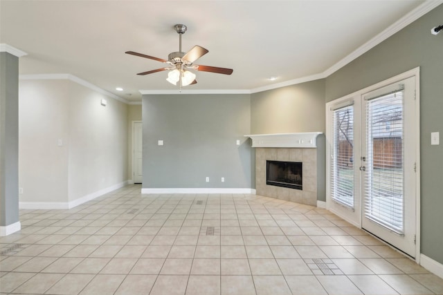 unfurnished living room with a tile fireplace, ornamental molding, light tile patterned floors, and ceiling fan