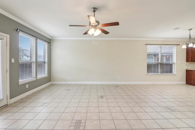 tiled spare room with ornamental molding and ceiling fan with notable chandelier