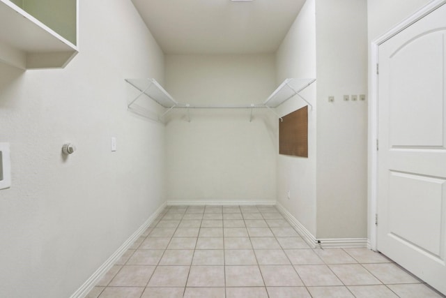 walk in closet featuring light tile patterned floors