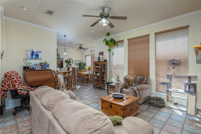 living room featuring ornamental molding and ceiling fan