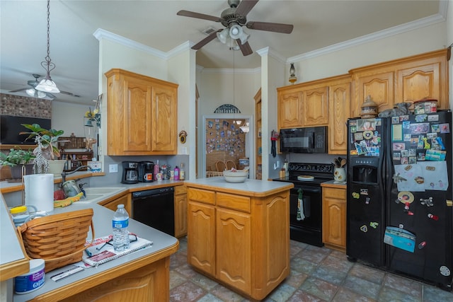 kitchen featuring pendant lighting, ornamental molding, a center island, and black appliances