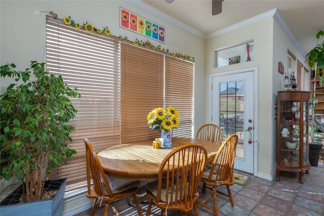 dining area featuring crown molding and ceiling fan