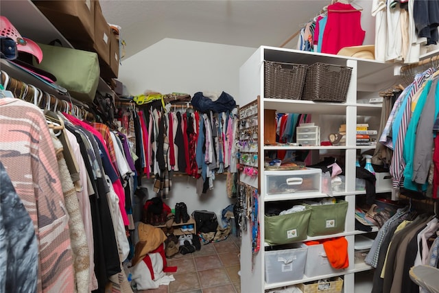 spacious closet featuring light tile patterned floors