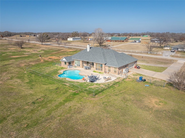 birds eye view of property featuring a rural view