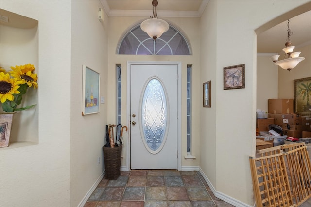 foyer featuring crown molding