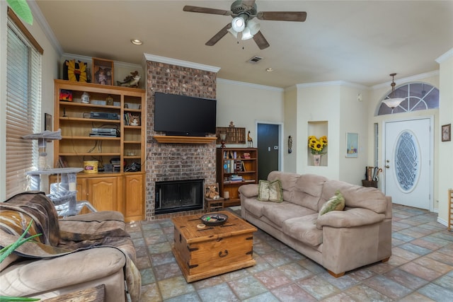 living room featuring ceiling fan, ornamental molding, and a brick fireplace