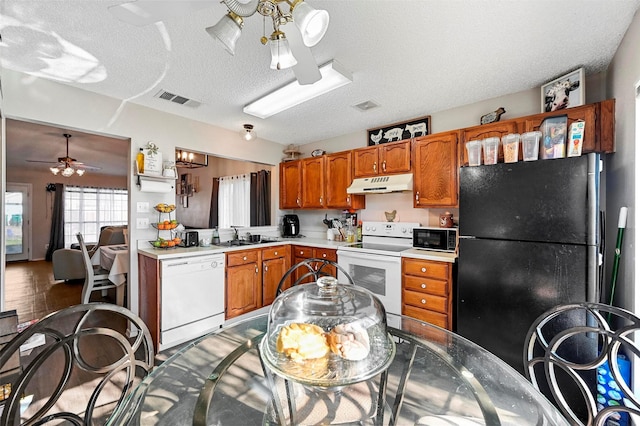 kitchen featuring sink, a textured ceiling, black appliances, and ceiling fan