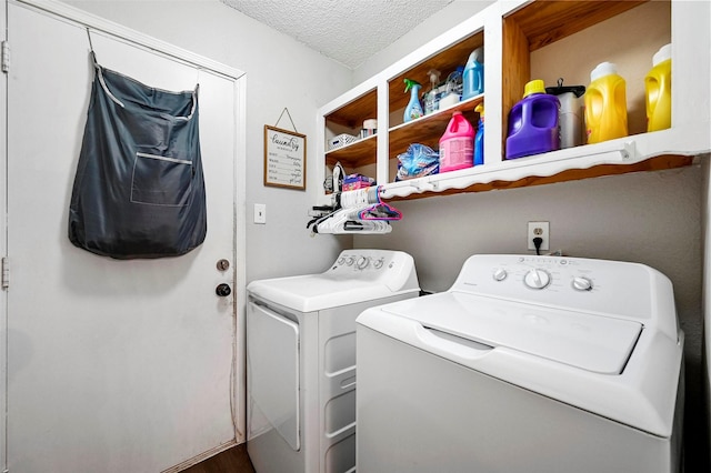 washroom featuring separate washer and dryer and a textured ceiling