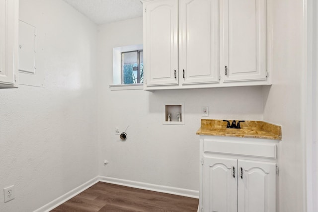 201 Trailwood Dr, Euless, TX 76039 - washroom with hookup for a washing machine, dark hardwood / wood-style floors, and cabinets